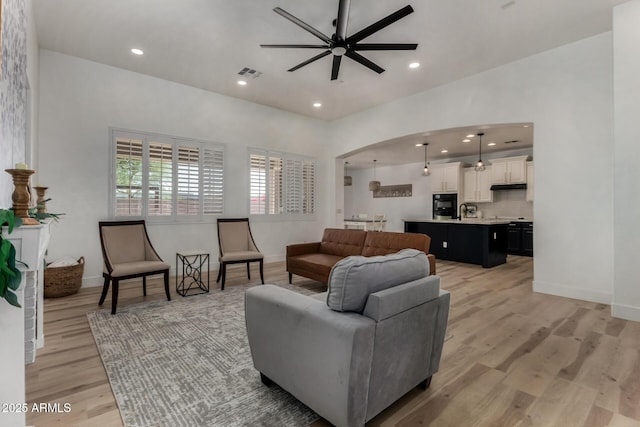 465 E Frances Ln, Gilbert, AZ 85295 - living area with ceiling fan, light wood-style floors, recessed lighting, and arched walkways