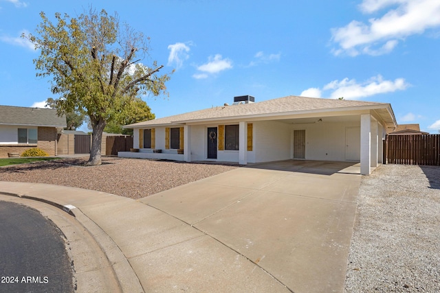 ranch-style house with a carport