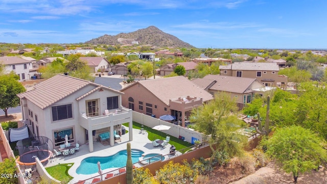 birds eye view of property with a residential view and a mountain view