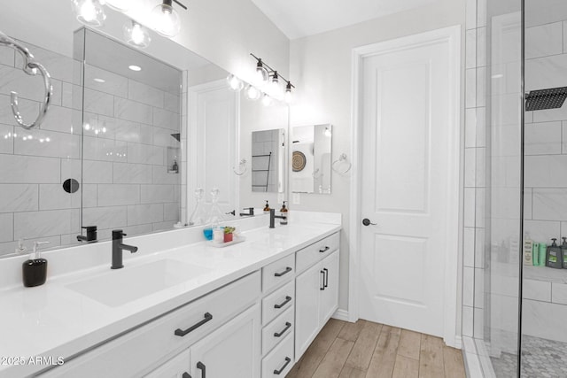 bathroom with an enclosed shower and vanity