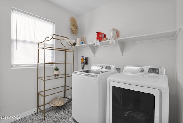 laundry area with independent washer and dryer and tile patterned flooring