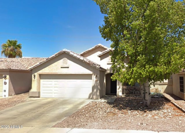 2809 N 107th Dr, Avondale, AZ 85392 - view of front of property with driveway, stucco siding, and an attached garage