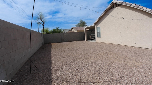 2809 N 107th Dr, Avondale, AZ 85392 - view of yard featuring a fenced backyard and a patio area
