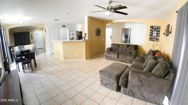 2809 N 107th Dr, Avondale, AZ 85392 - living area featuring a ceiling fan, light tile patterned floors, and arched walkways