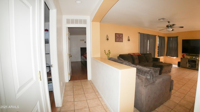 2809 N 107th Dr, Avondale, AZ 85392 - hall featuring light tile patterned flooring, arched walkways, and visible vents
