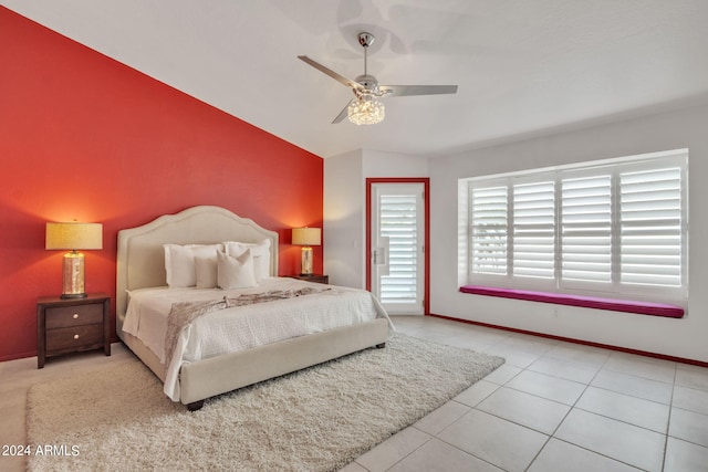 tiled bedroom with ceiling fan