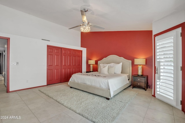 bedroom with multiple windows, light tile patterned floors, a closet, and ceiling fan