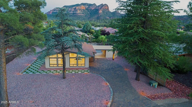21 Hummingbird Cir, Sedona, AZ 86336 - view of front of property with stucco siding and decorative driveway