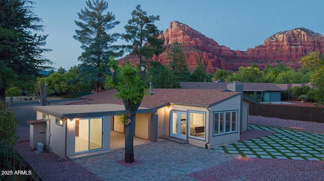 21 Hummingbird Cir, Sedona, AZ 86336 - back of house featuring a patio area and a mountain view