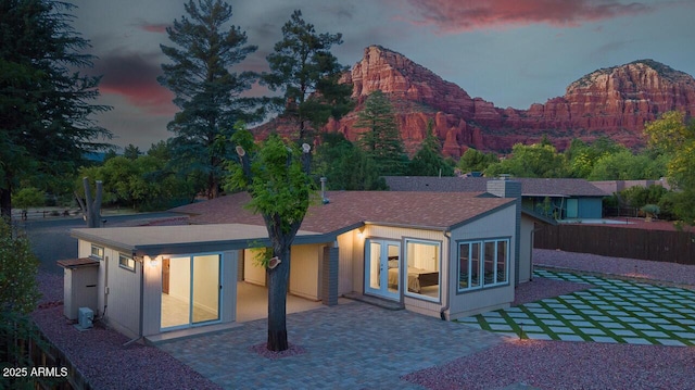 21 Hummingbird Cir, Sedona, AZ 86336 - back of house featuring a patio area, a mountain view, and stucco siding