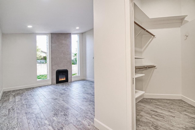 21 Hummingbird Cir, Sedona, AZ 86336 - walk in closet featuring wood finished floors and a fireplace
