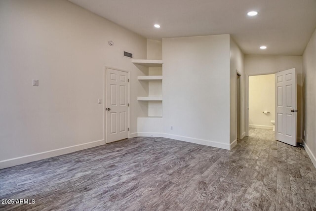 21 Hummingbird Cir, Sedona, AZ 86336 - unfurnished room featuring wood finished floors, recessed lighting, baseboards, and built in features