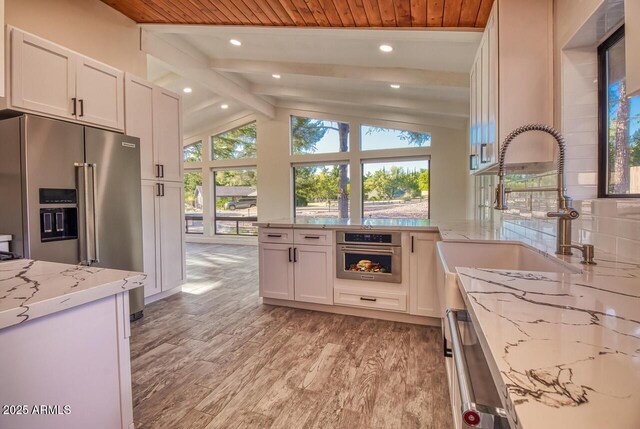 21 Hummingbird Cir, Sedona, AZ 86336 - kitchen featuring stainless steel appliances, a sink, light stone counters, recessed lighting, and white cabinetry