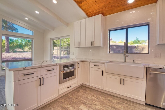 21 Hummingbird Cir, Sedona, AZ 86336 - kitchen featuring stainless steel appliances, a peninsula, a sink, recessed lighting, and wood ceiling