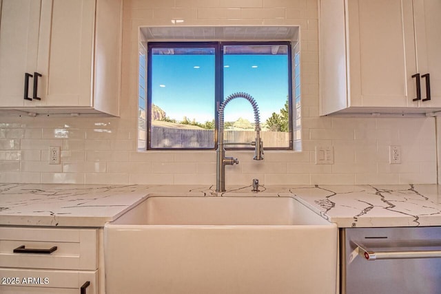 21 Hummingbird Cir, Sedona, AZ 86336 - kitchen featuring a sink, backsplash, white cabinetry, and light stone countertops
