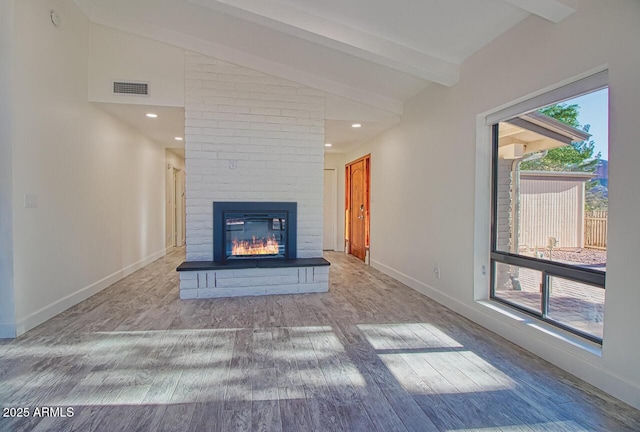 21 Hummingbird Cir, Sedona, AZ 86336 - unfurnished living room featuring wood finished floors, a fireplace, baseboards, and recessed lighting