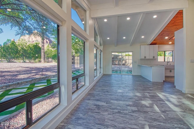 21 Hummingbird Cir, Sedona, AZ 86336 - unfurnished sunroom featuring recessed lighting, baseboards, beamed ceiling, high vaulted ceiling, and a sink