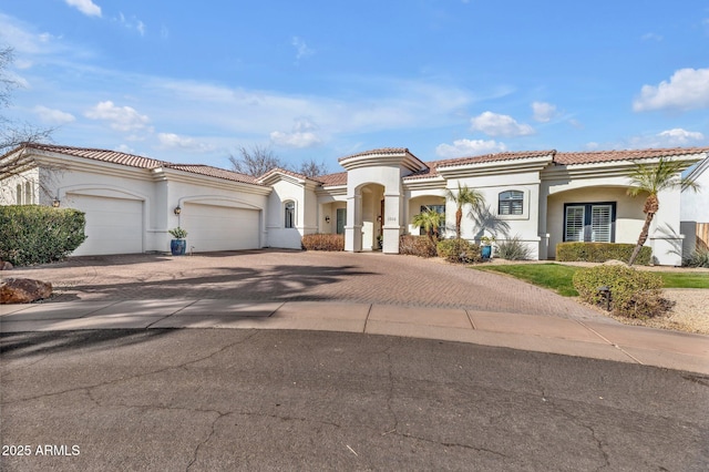 mediterranean / spanish-style house featuring a garage