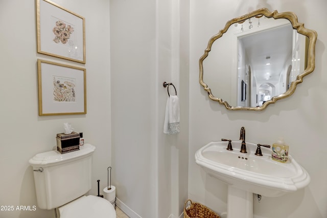 bathroom with sink and toilet