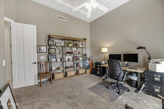 office featuring ceiling fan, carpet flooring, and high vaulted ceiling