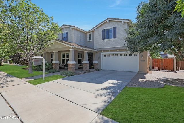 view of front of house with a garage and a front yard