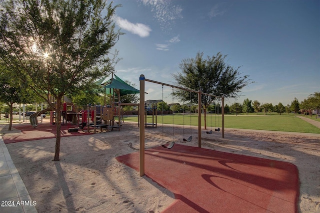 view of playground with a lawn