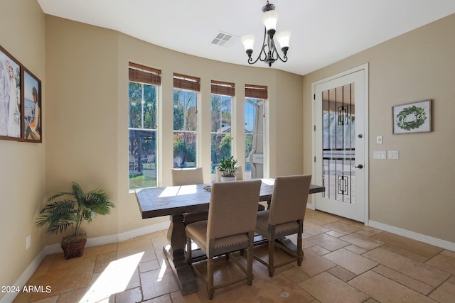 dining area with a notable chandelier