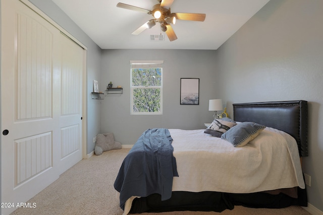 bedroom featuring a closet, carpet, and ceiling fan