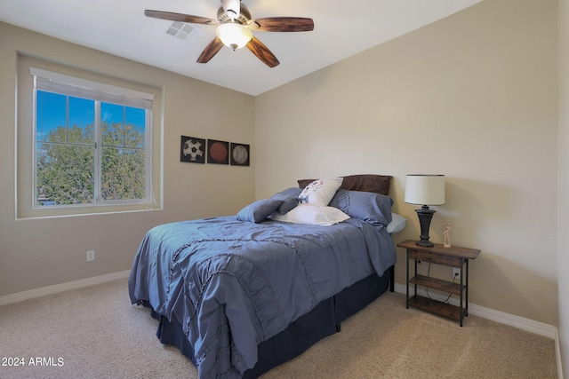 carpeted bedroom featuring ceiling fan