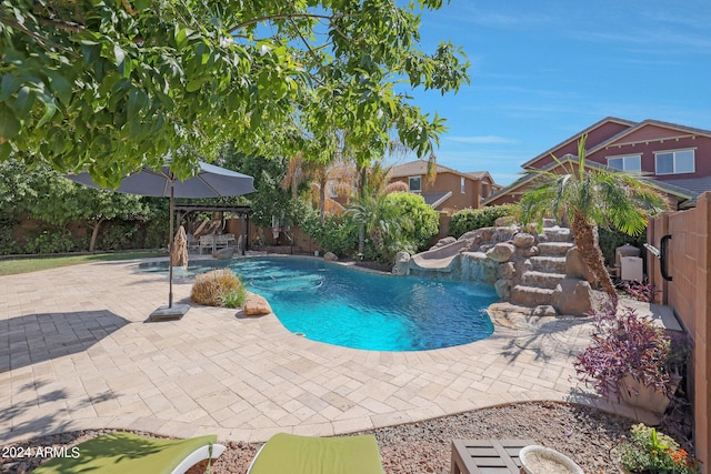 view of swimming pool featuring a patio and pool water feature