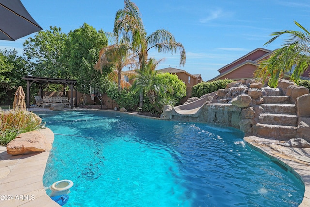 view of swimming pool featuring a pergola, a patio, and pool water feature