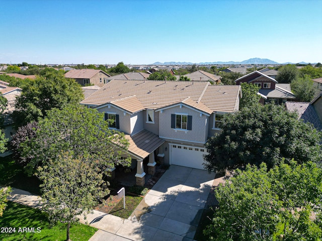 birds eye view of property featuring a mountain view