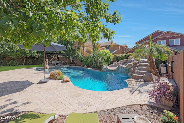 view of pool featuring a patio and pool water feature