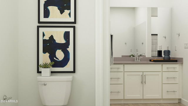 bathroom with toilet and vanity