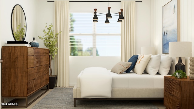 bedroom featuring a chandelier