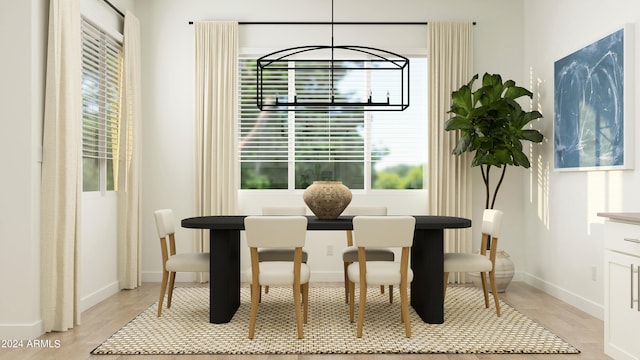 dining space featuring light hardwood / wood-style flooring and plenty of natural light