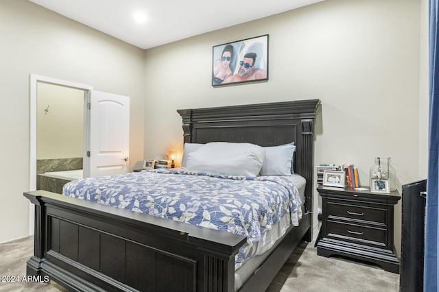 carpeted bedroom featuring connected bathroom