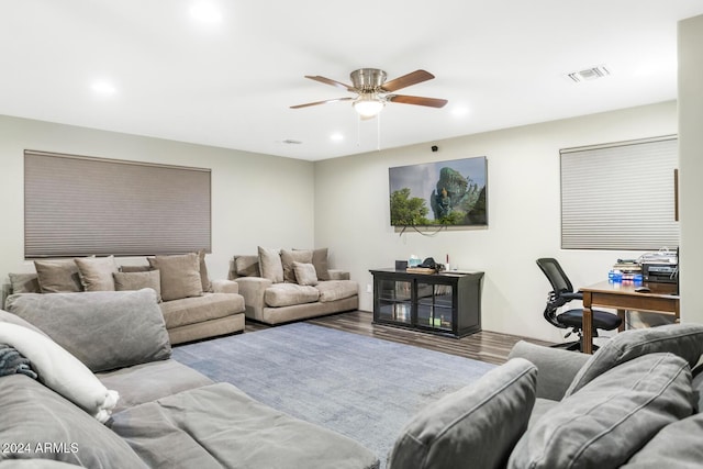 living room featuring ceiling fan and light wood-type flooring