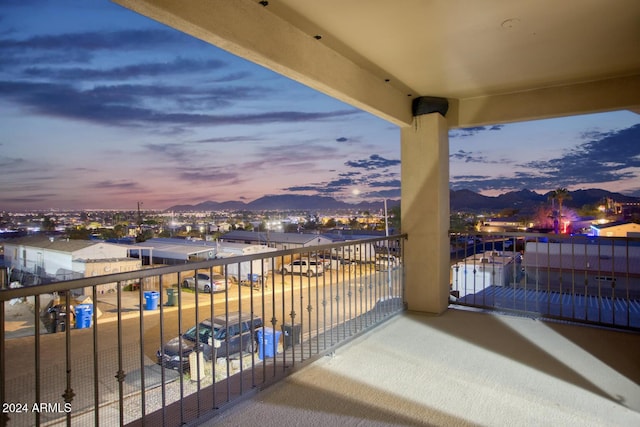 balcony at dusk with a mountain view