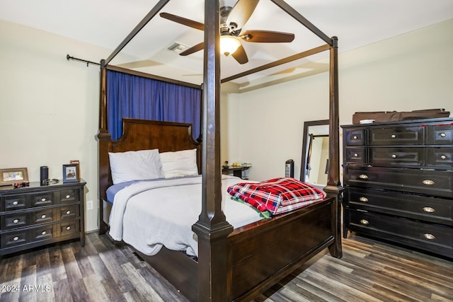 bedroom with ceiling fan and dark hardwood / wood-style floors