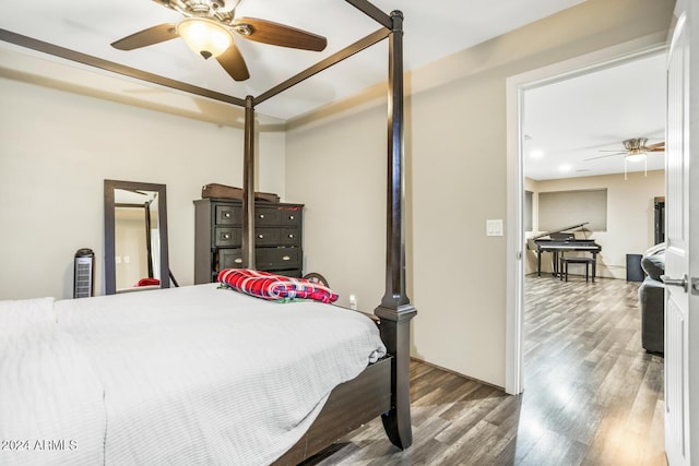 bedroom with hardwood / wood-style flooring and ceiling fan