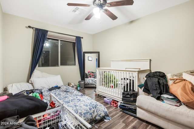 bedroom with hardwood / wood-style floors and ceiling fan