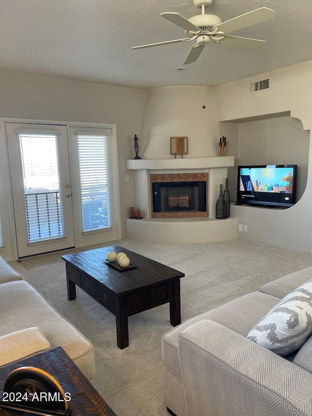 living room with ceiling fan and light colored carpet