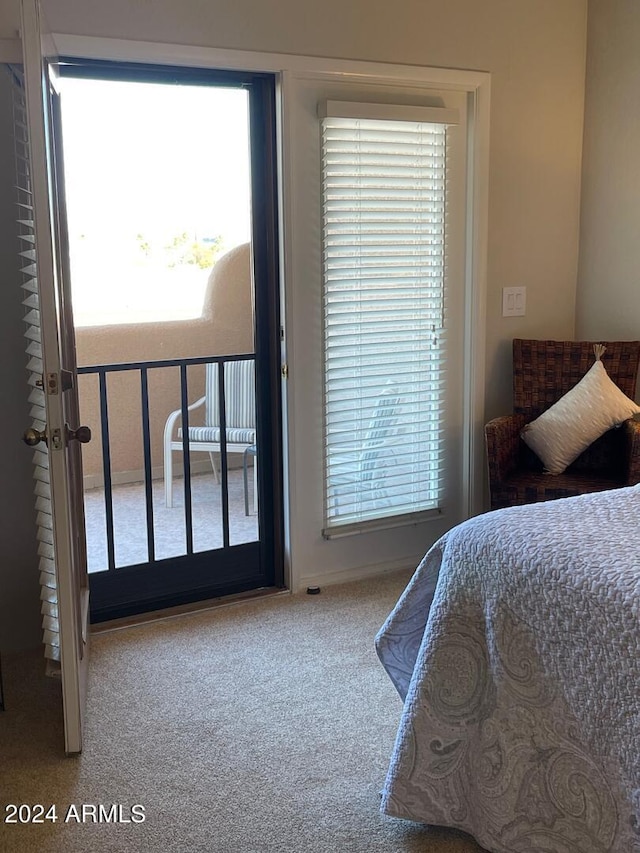 bedroom featuring light colored carpet