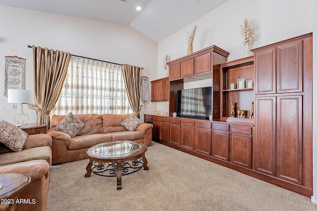 carpeted living room with vaulted ceiling