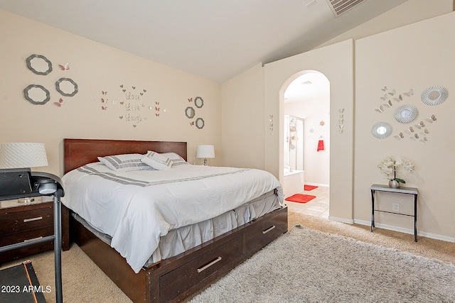 carpeted bedroom with lofted ceiling