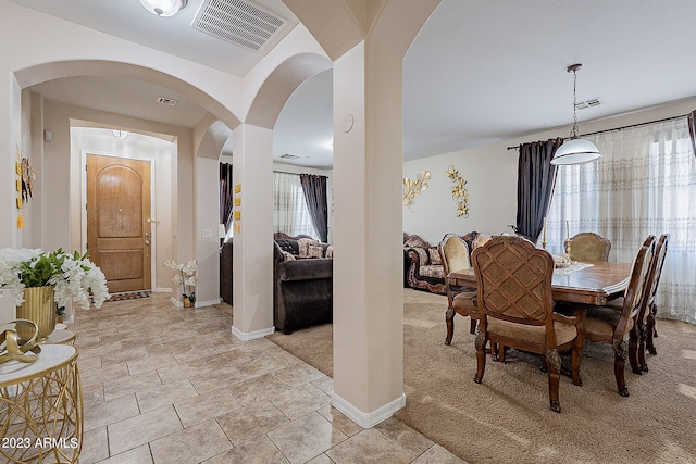 view of carpeted dining space