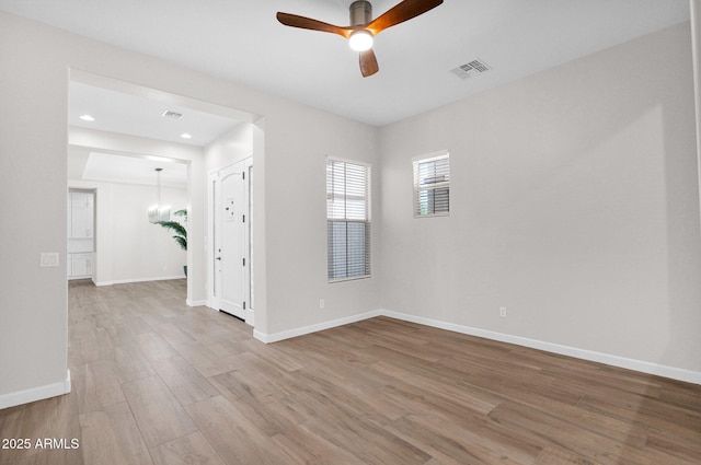 20115 E Sonoqui Blvd E, Queen Creek, AZ 85142 - spare room with ceiling fan, wood finished floors, and recessed lighting