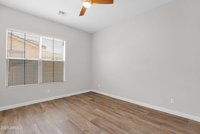 20115 E Sonoqui Blvd E, Queen Creek, AZ 85142 - unfurnished room with wood finished floors and a ceiling fan