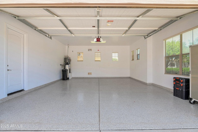 20115 E Sonoqui Blvd E, Queen Creek, AZ 85142 - garage featuring baseboards and water heater